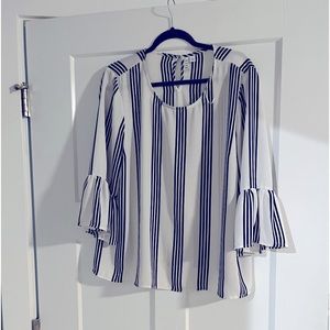 White blouse with black stripes and bell sleeves